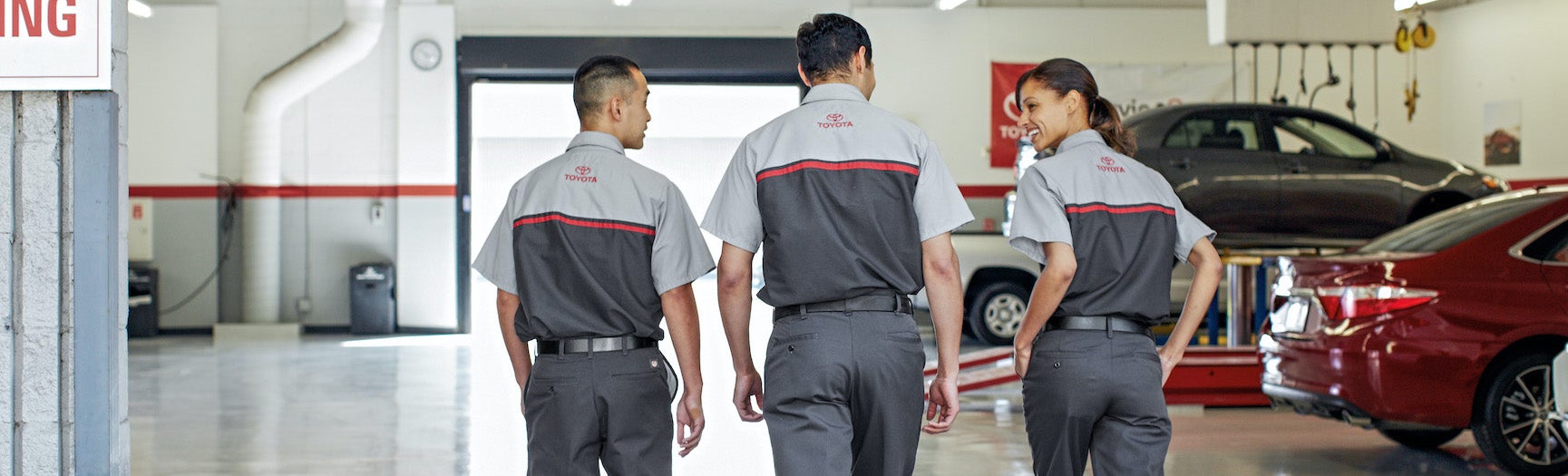 Bennett Toyota of Lebanon is a Car Dealership near Cleona, PA | Toyota Service Technicians walking and talking in Toyota service center