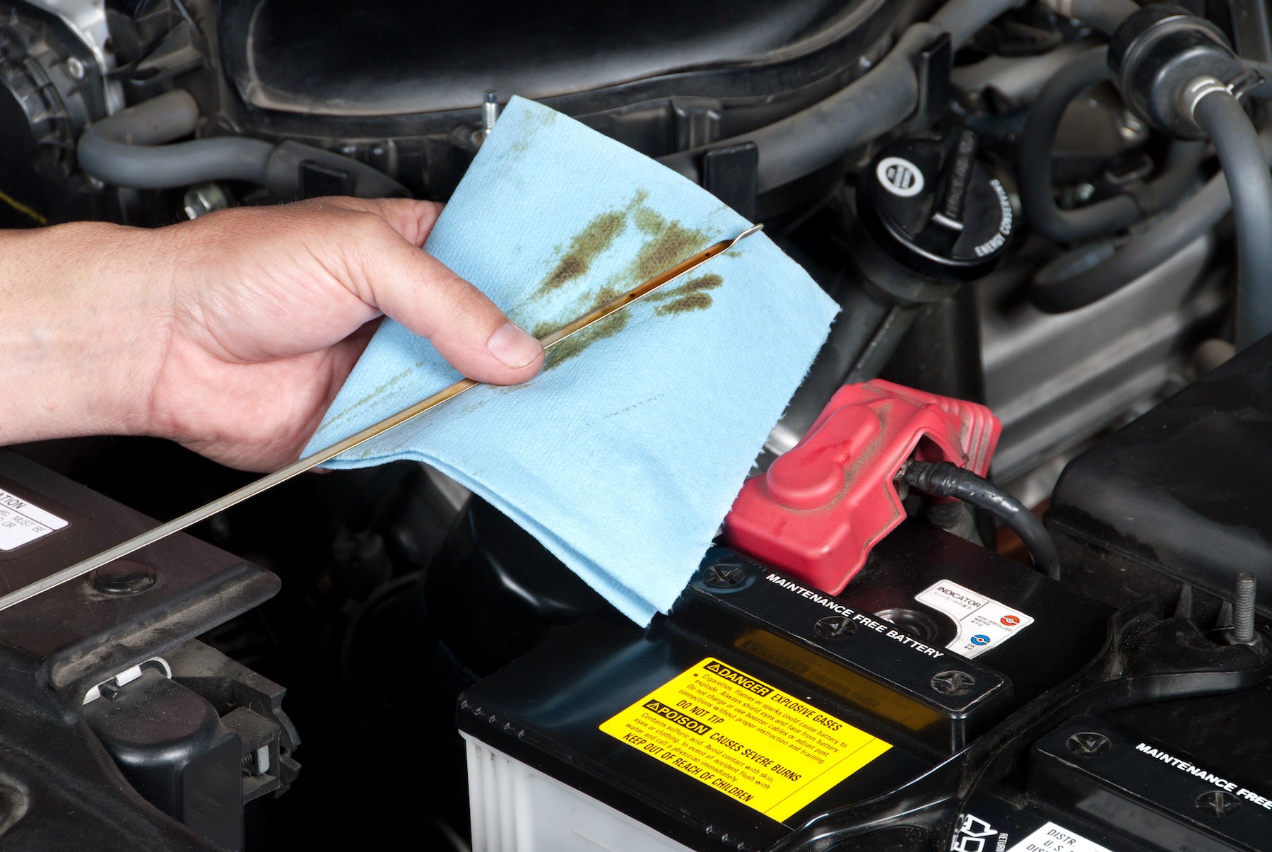 Benefits of Changing Your Toyota’s Oil at Bennett Toyota in Allentown | Technician Testing Engine's Oil Level