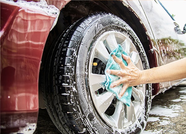 Bennett Toyota Of Lebanon | Man Washing Car Tire